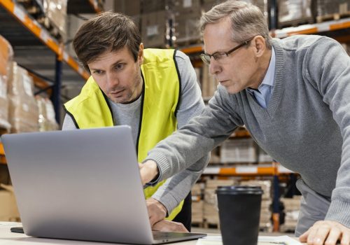 men-warehouse-working-laptop